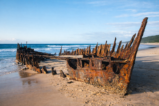 The salvaged structural remnants of the 19th-century coastal steamer on display near the beach.