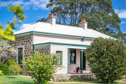 The colonial homestead Applegarth with its verandah, surrounded by South Coast farmland