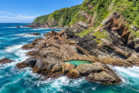 Clear, still rock pools on the rock shelf around the headland from Burgess Beach, Forster