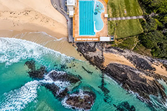 Small, sandy-bottomed rock pool on the coastal rock shelf at Port Kembla Beach