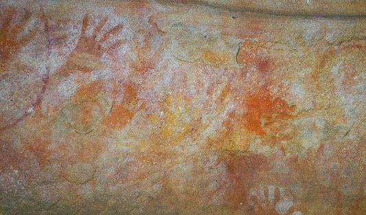 Ancient Aboriginal hand stencils in red and white ochre at Red Hands Cave Glenbrook
